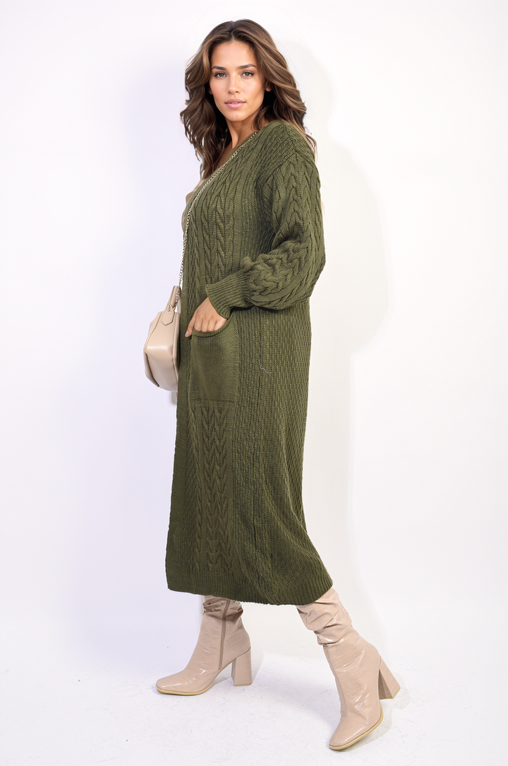 Woman wearing the Front Open Long Knitted Cardigan with Front Pockets, styled with white boots, showcasing its cozy and chic design.