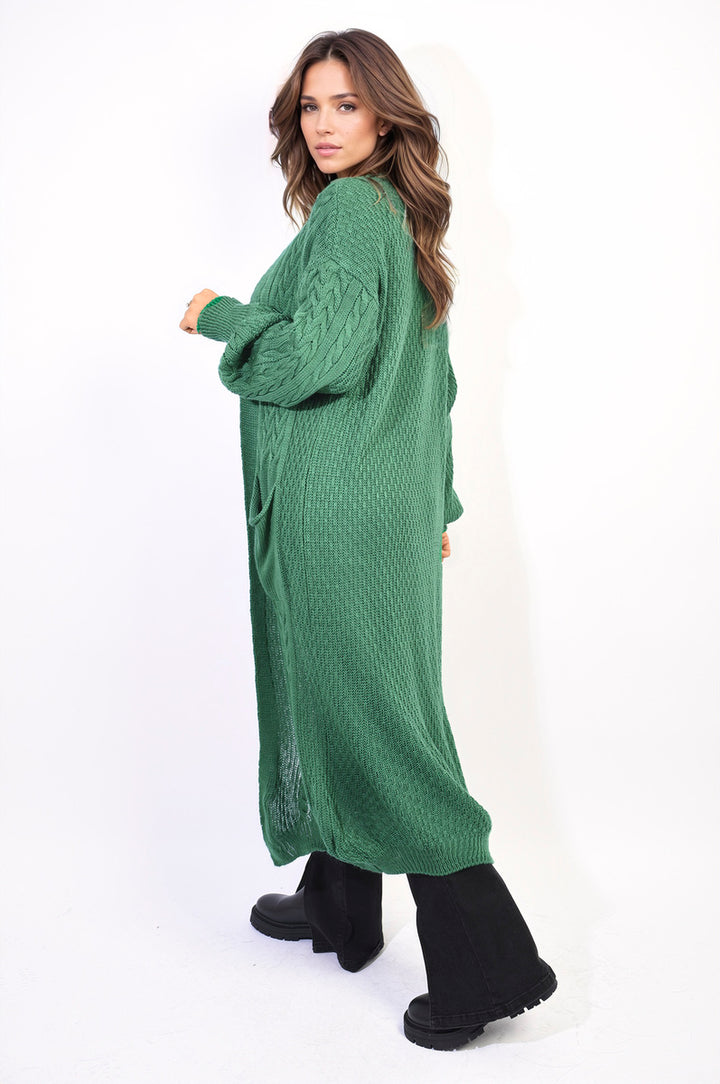 Woman wearing the Front Open Long Knitted Cardigan with Front Pockets, showcasing its cozy, stylish design and practical features. Ideal for everyday wear.