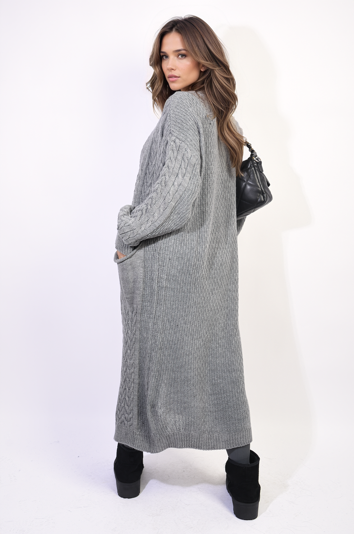 Front Open Long Knitted Cardigan with Front Pockets worn by a woman, showcasing its cozy design and practical style, ideal for everyday wear.