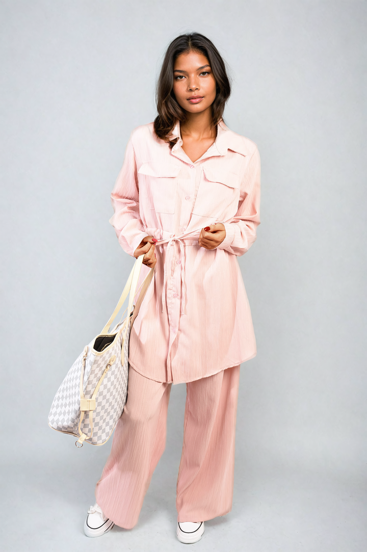 Woman wearing the Oversized Long Sleeve Belted Button Down Top and Trouser Co-ord Set, showcasing its stylish oversized fit and belted waist design.