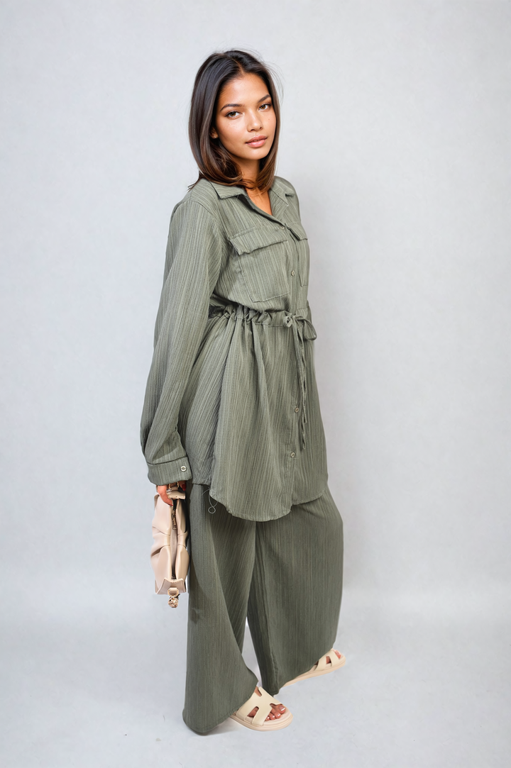 Woman wearing Oversized Long Sleeve Belted Button Down Top and Trouser Co-ord Set, featuring an oversized fit and wide-leg trousers, embodying chic and versatile fashion.