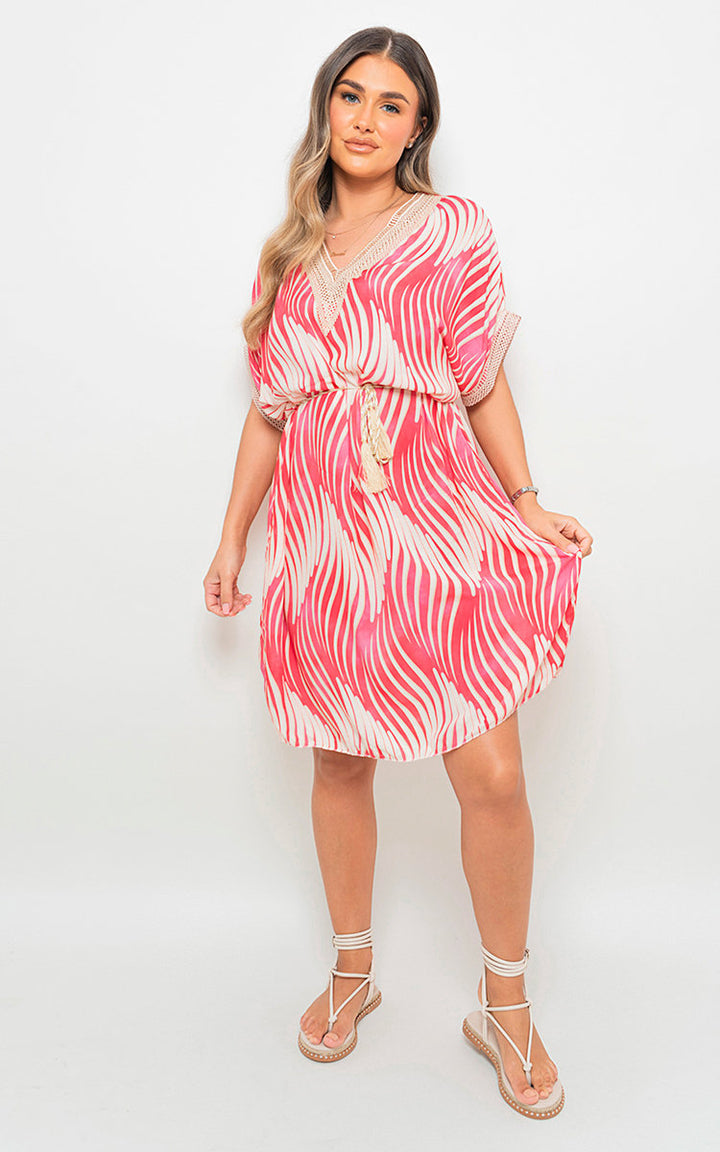 Woman in Belted Lace Panel Printed Mini Dress, featuring intricate lace panels and vibrant print, ideal for stylish holiday and everyday wear from Holiday Clothes UK.