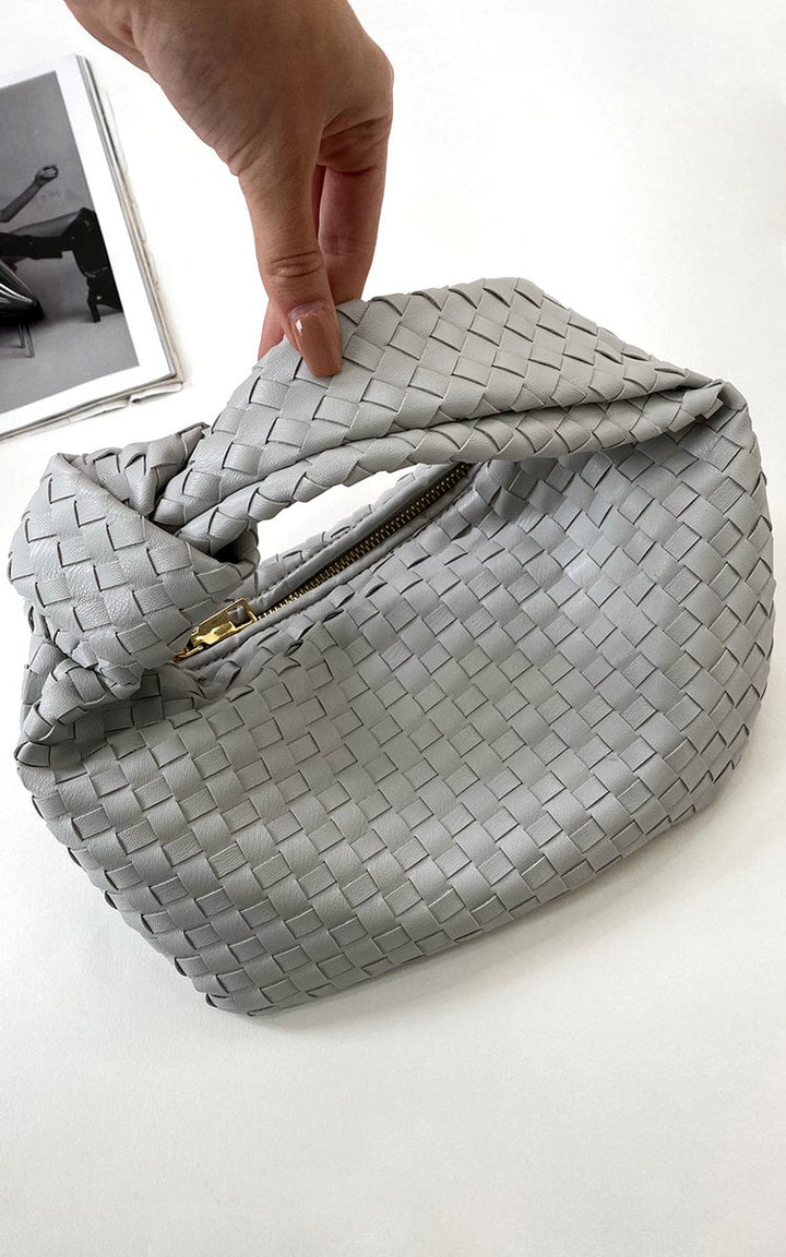 Faux Leather Quilted Handbag being held, showcasing its structured design and quilted texture, ideal for transitioning from day to night.