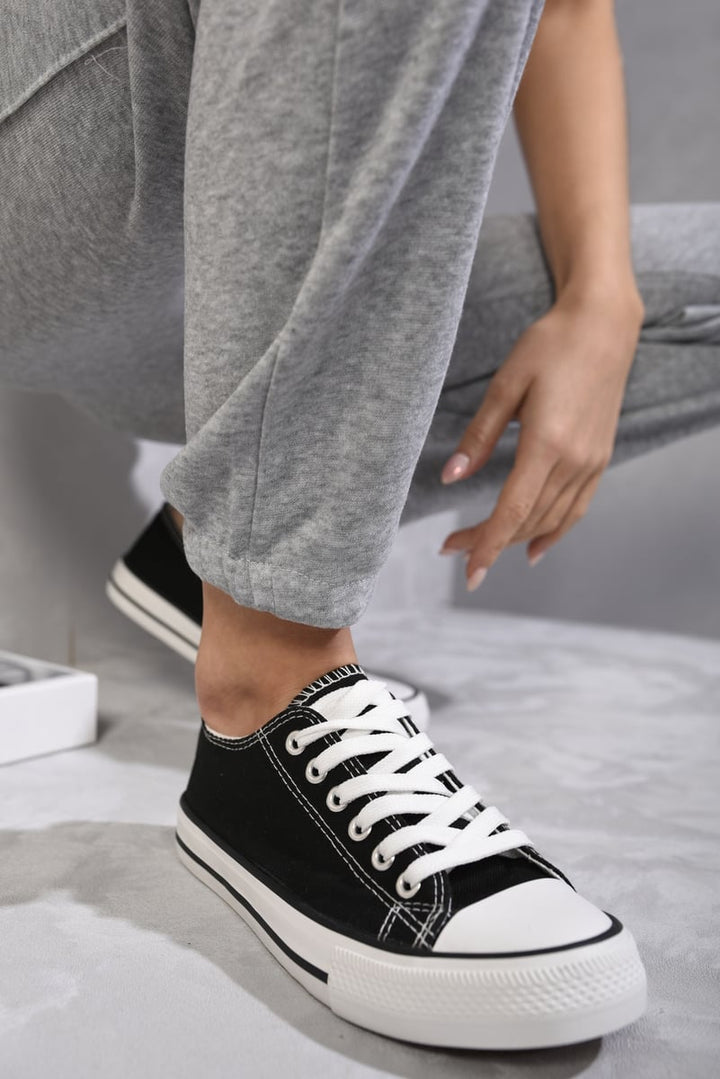 Platform Low Top Lace Up Trainers on a person's foot, showcasing stylish design and comfort, ideal for enhancing casual holiday outfits from Holiday Clothes UK.