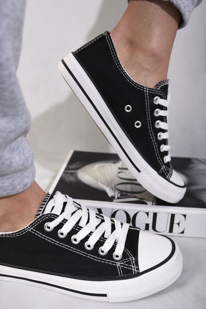 Platform Low Top Lace Up Trainers on feet, showcasing their sleek design and secure lace-up fit, ideal for stylish everyday wear.