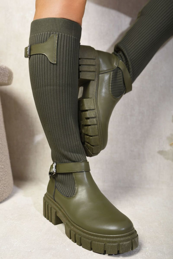 Close-up of a person wearing the Stretch Knee High Chunky Sock Boots, showcasing the snug fit and chunky sole designed for comfort and style.