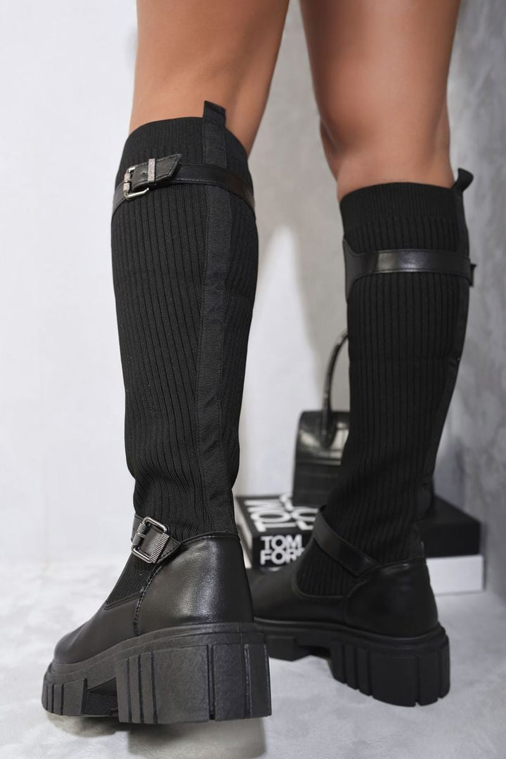 Stretch Knee High Chunky Sock Boots worn by a person, showcasing their sleek, snug fit and chunky sole, perfect for stylish comfort on chilly days.