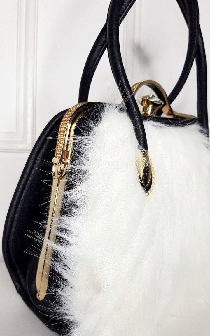 Faux Fur Handbag featuring a black and white design with faux fur front, faux leather back, and gold diamante clip fastening.