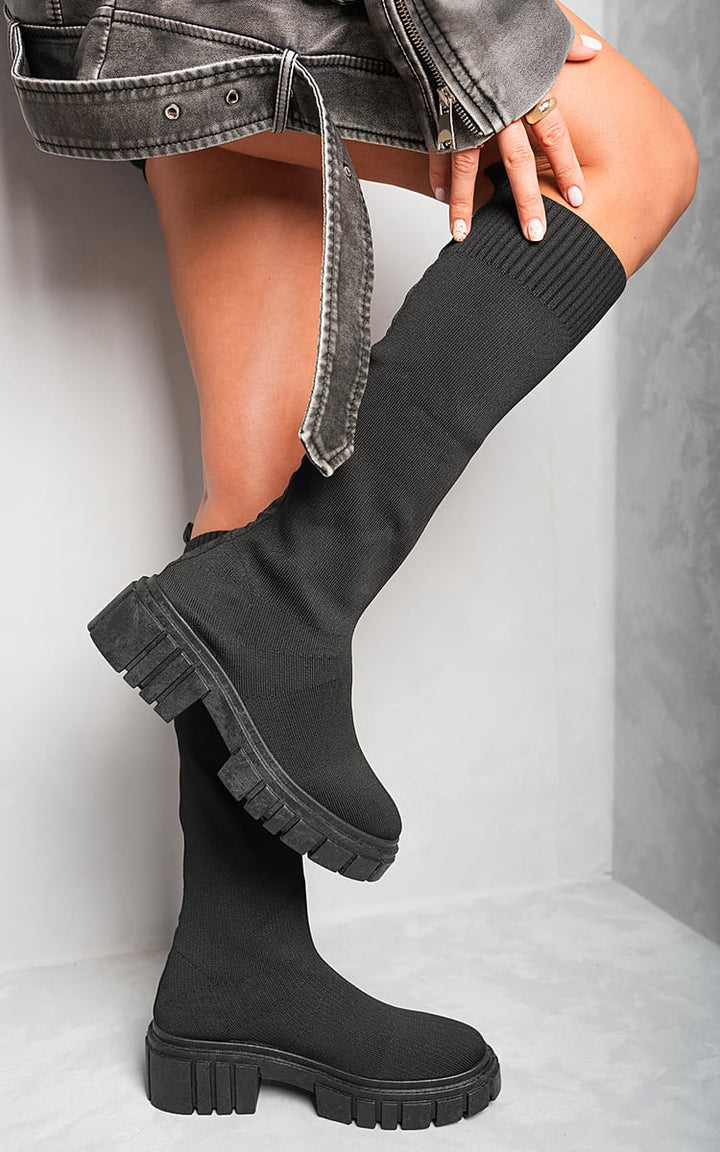 Knee High Chunky Sock Boots featuring a cozy, snug fit and chunky heel, perfect for stylish and versatile looks. Ideal for urban and countryside adventures.