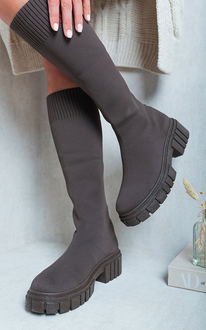 Knee High Chunky Sock Boots on person, showcasing cozy sock fit and chunky heel, ideal for stylish, comfortable urban or countryside wear.