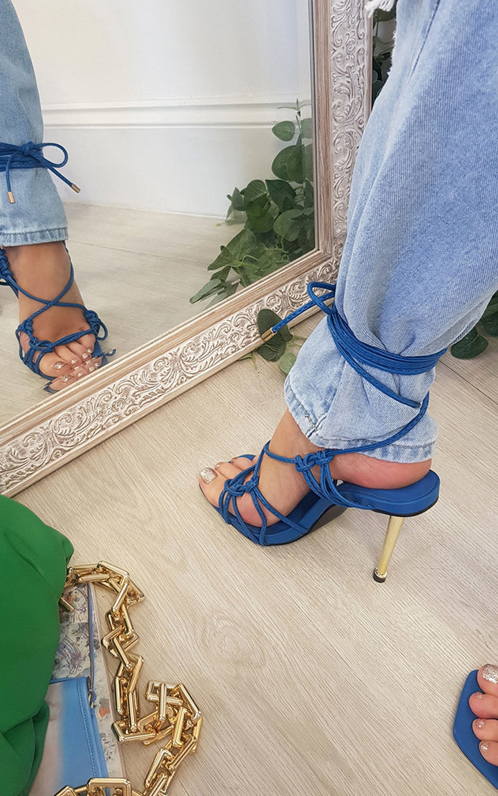 Strappy Square Toe Heels with blue detailing, elegantly wrapped around the ankle, perfect for adding a chic edge to any night-out ensemble.