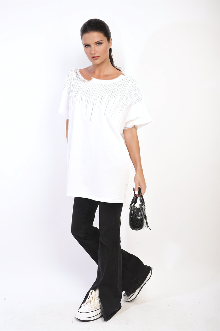 Woman in a white Embellished Neckline Short Sleeve Top, holding a black purse, styled for a chic and casual look.