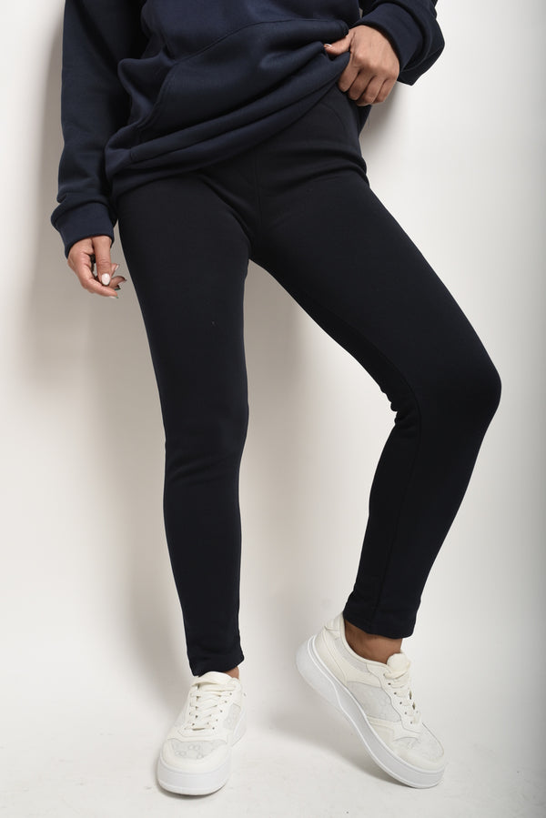 High Waisted Stretch Leggings worn with white shoes, showcasing a comfortable fit ideal for active lifestyles or casual wear.