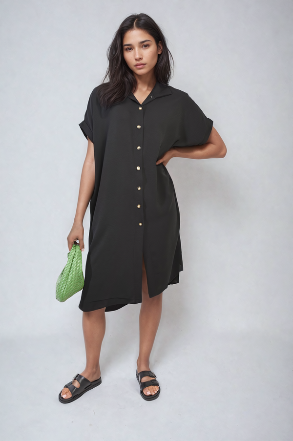 Button Front Shirt Dress worn by a woman, showcasing its elegant silhouette and versatile style, ideal for summer occasions.