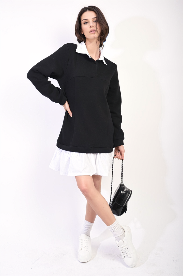 Woman wearing the Kayla Collared Long Sleeve Mini Dress, showcasing its elegant design and trendy appeal, paired with white shoes and a black bag.