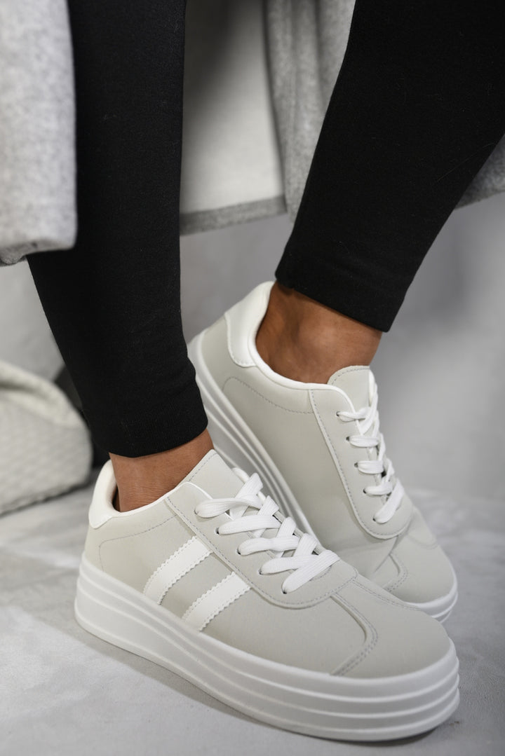 Person wearing Kaylee Lace Up Platform Trainers, showcasing trendy platform sole for added height and style, suitable for everyday comfort and fashion-forward look.