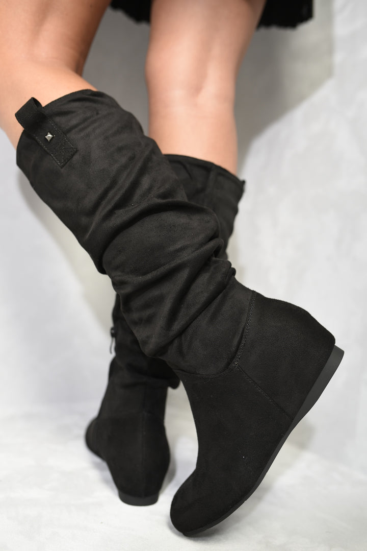 Slouchy Zip Detail Knee High Boots worn by a person, showcasing their relaxed slouchy design and stylish zip detail, ideal for casual elegance.