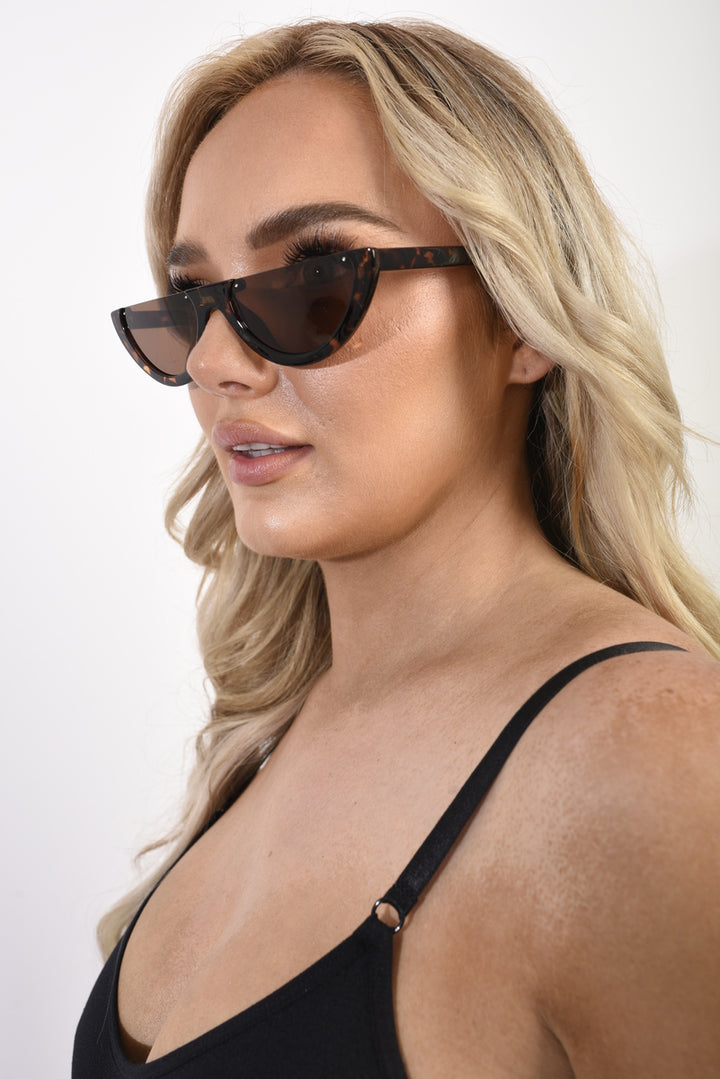 Retro Half Frame Rimless Sunglasses showcased on a woman, highlighting the stylish and chic design that elevates any outfit, perfect for fashion-forward individuals.