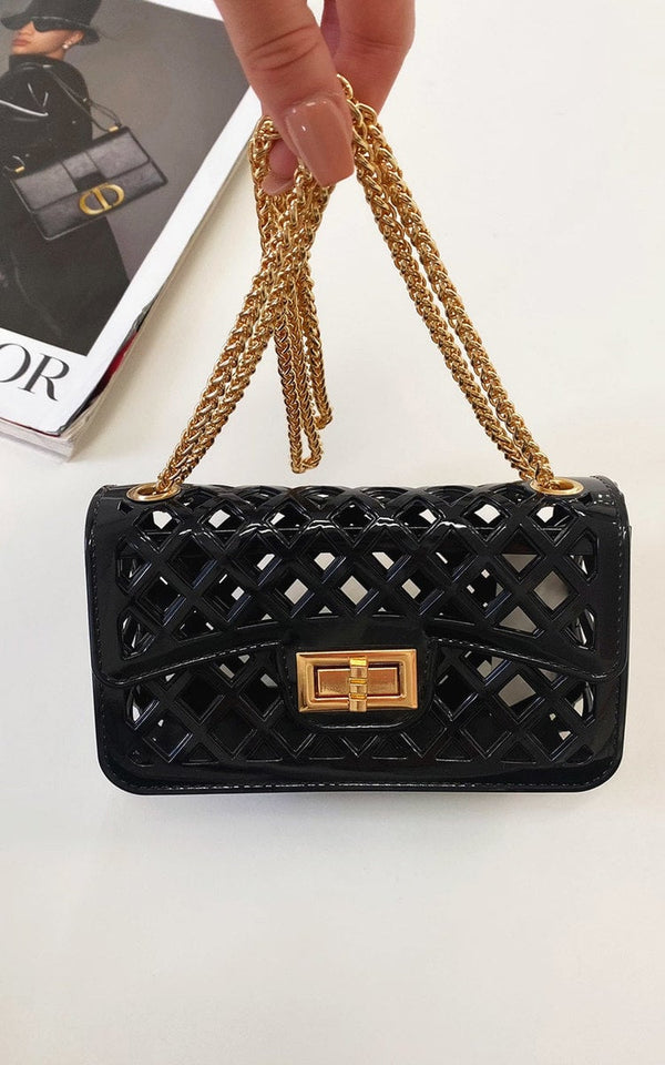 Chain Detail Handbag featuring a chic quilted design with gold chains and fastenings, perfect for adding elegance to any outfit from Holiday Clothes UK.