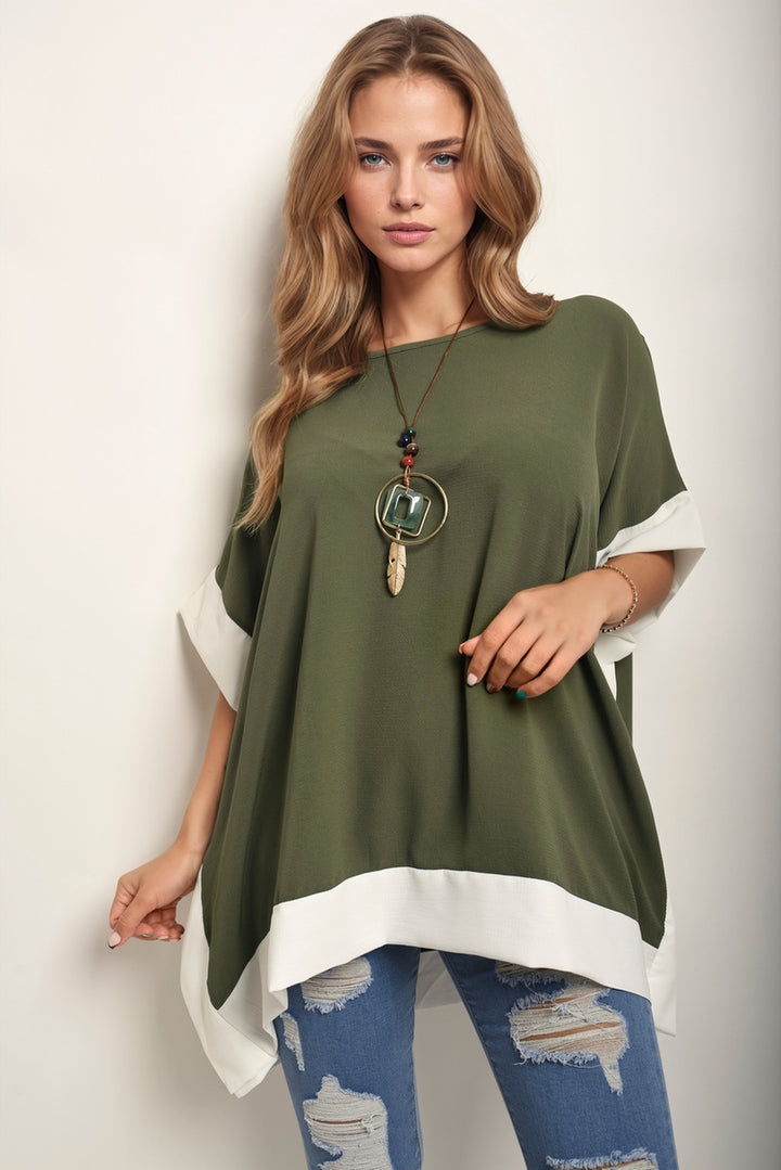 Laura Oversized Contrast Hem Flare Sleeve Top with bold hem and flared sleeves, worn by a woman with jeans, showcasing relaxed elegance.