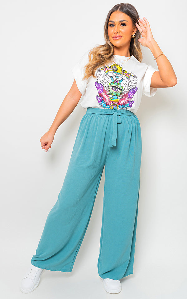 Woman wearing Drawstring Waist Wide Leg Trouser, showcasing its relaxed fit and wide-leg design for chic, comfortable style. Perfect for versatile, everyday wear.