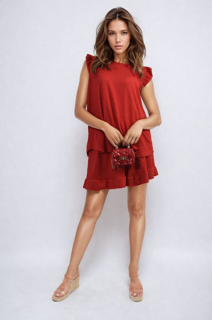 Woman in a red Ruffle Trim Sleeve Top and Shorts Co-ord Set, showcasing its stylish design and elegant fit.