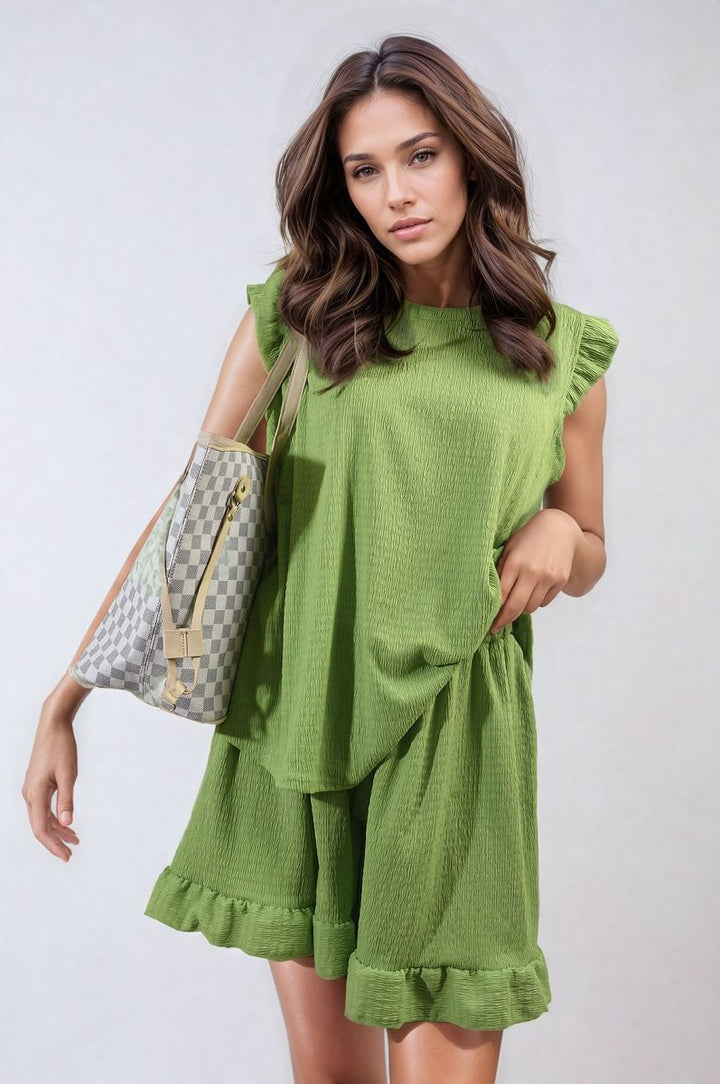 Woman in a green Ruffle Trim Sleeve Top and Shorts Co-ord Set, highlighting the ruffle sleeves and high-waisted shorts, perfect for summer elegance.