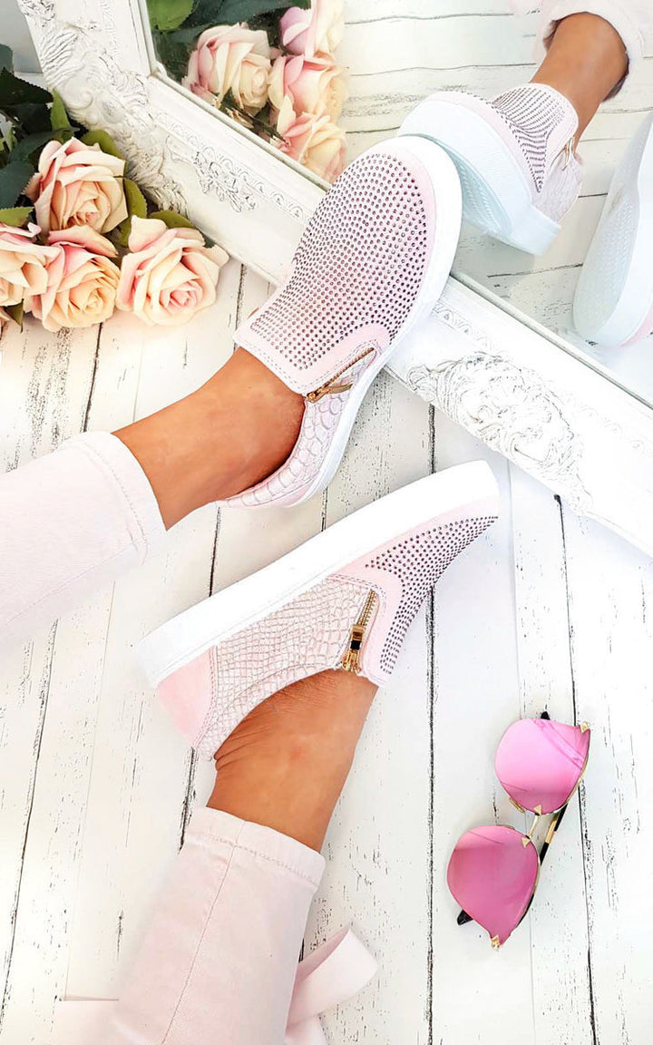 Slip On Embellished Trainers with pink diamante front and croc-style back, paired with pink sunglasses and roses, perfect for stylish holiday looks.