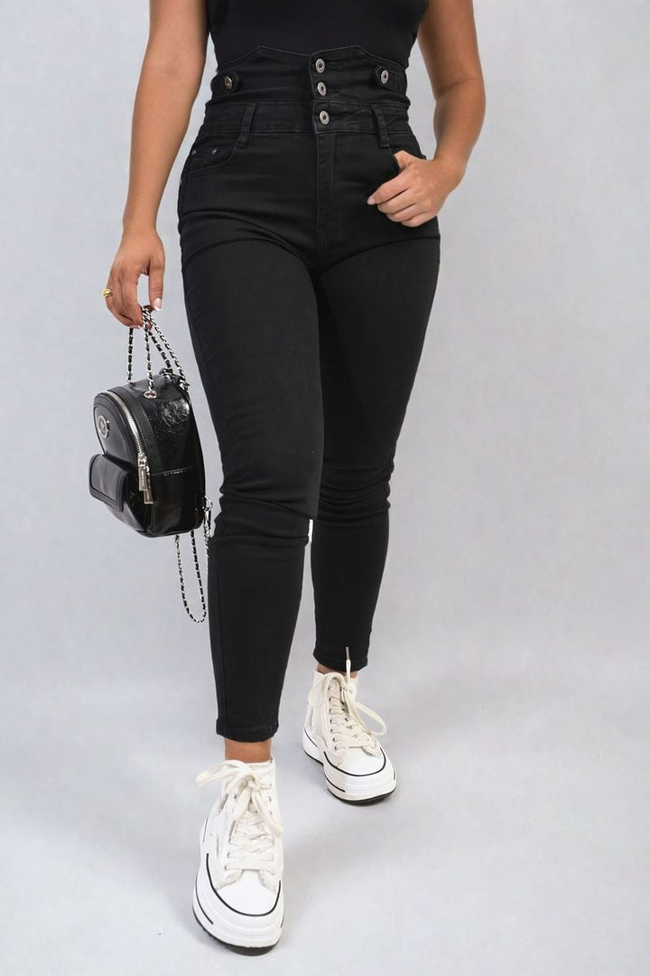 High Waist Button Skinny Jeans showcased with a black handbag and white sneakers, highlighting a chic, casual look. Perfect for enhancing your stylish wardrobe.