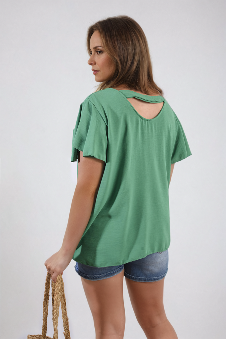 Woman wearing the Leilani Ruffle Short Sleeve Top, featuring playful ruffled sleeves and a casual, stylish design, perfect for warm weather outings.