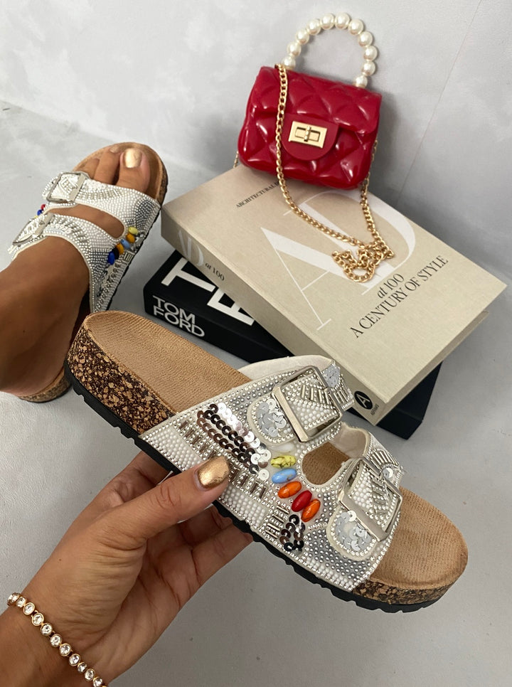 Rhinestone Double Buckle Adjustable Slip-On Slides Sandals with sparkling double buckles, showcased alongside a red purse, perfect for stylish summer outings.