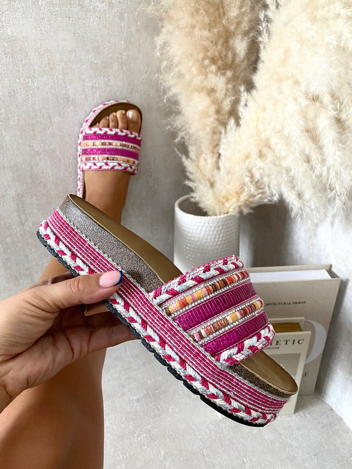 Person holding the Lilian Thick Wedge Heel Braided Platform Sandals, showcasing its stylish design and comfortable wedge heel for fashionable summer wear.