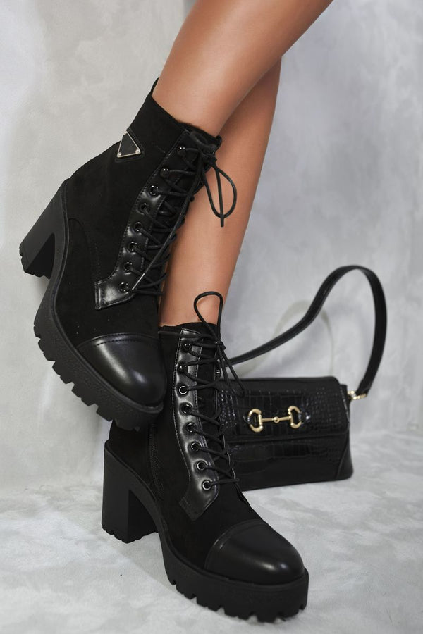 Lace Up Combat Heeled Ankle Boots showcasing a chic lace-up design with a stylish heel, perfect for adding an edgy touch to your outfit.