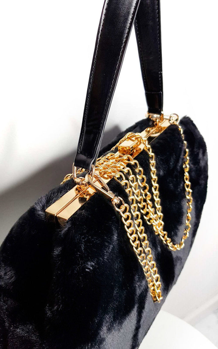 Fluffy HandBag with faux fur and gold chain strap, perfect for chic styling with holiday attire from Holiday Clothes UK.