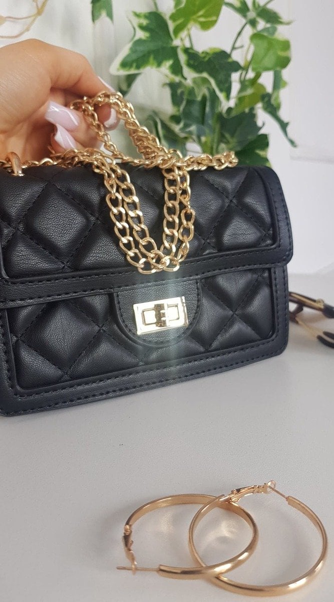 Quilted Chain Detail Handbag with gold chains, chic design ideal for elevating any outfit. Perfect accessory for stylish holiday or everyday wear.