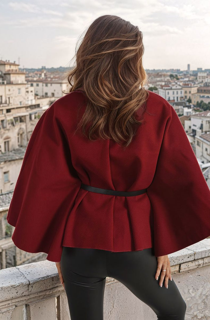 Woman wearing High Neck Belted Cape Jacket, showcasing elegant high neck and stylish belt, ideal for both formal and casual occasions.