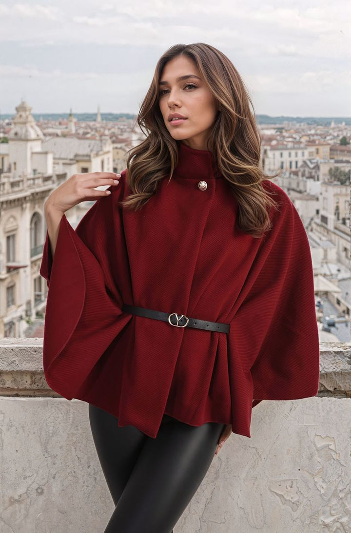 High Neck Belted Cape Jacket worn by a woman, showcasing its elegant design and stylish belt, ideal for versatile and polished looks.