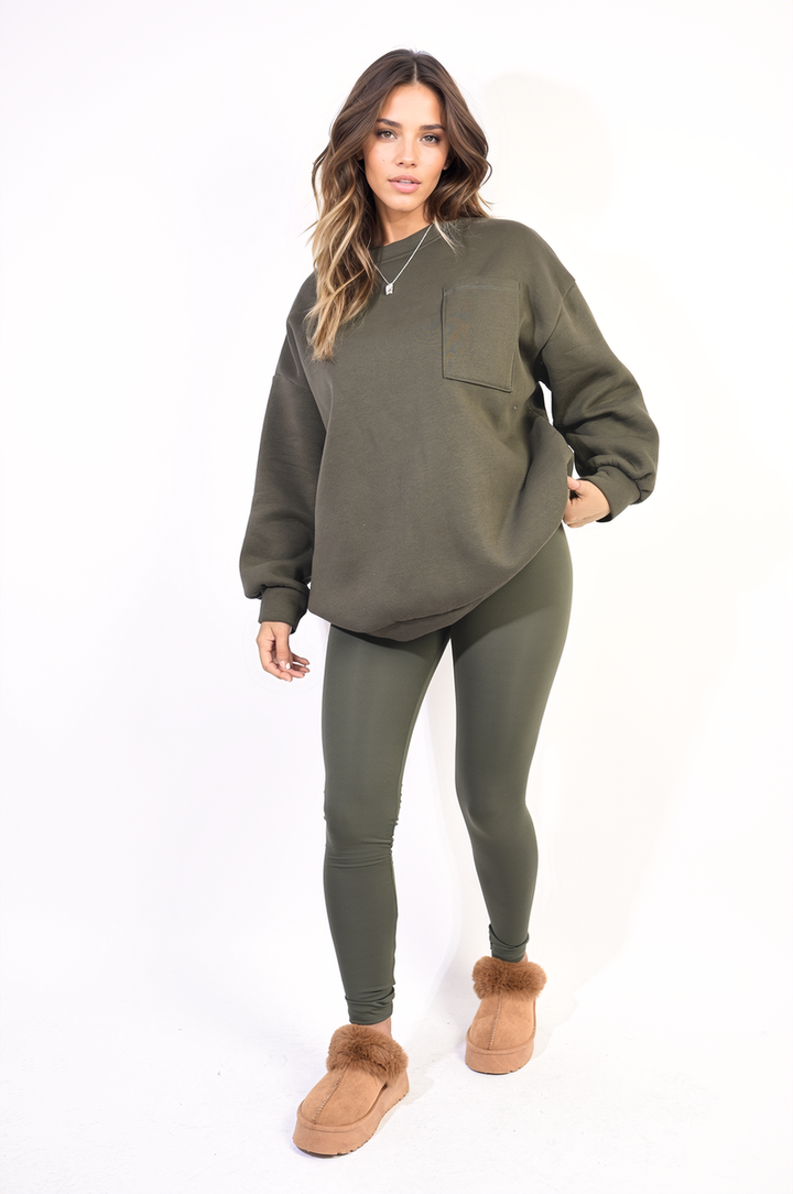 Woman wearing the Lucy Oversized Pocket Sweatshirt and Leggings Co-ord Set, featuring a cozy oversized sweatshirt and high-waisted leggings, ideal for casual or stylish looks.