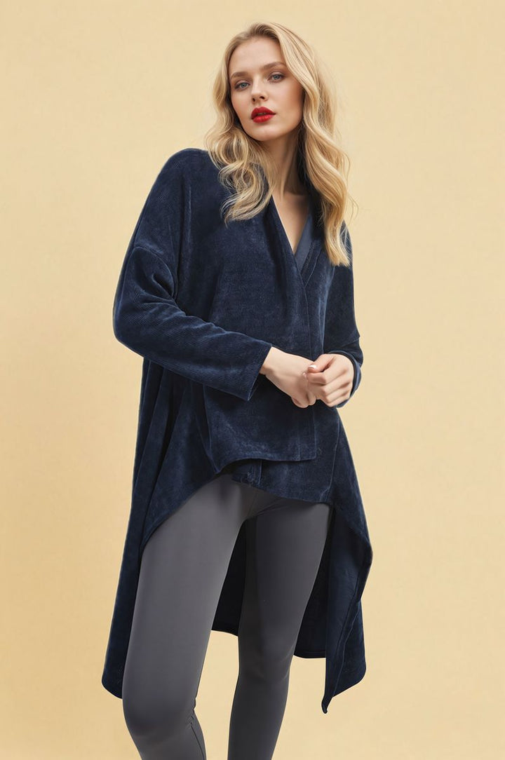 Woman wearing the Lydia Open Front Long Back Knitted Cardigan, showcasing its flowy design and cozy knit, ideal for stylish layering.