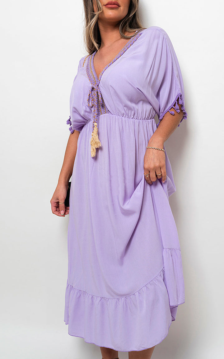 Lyra V-Neck Rope Tassel Detail Maxi Dress, featuring a flattering neckline and bohemian tassel accents, ideal for stylish holiday occasions and everyday elegance.