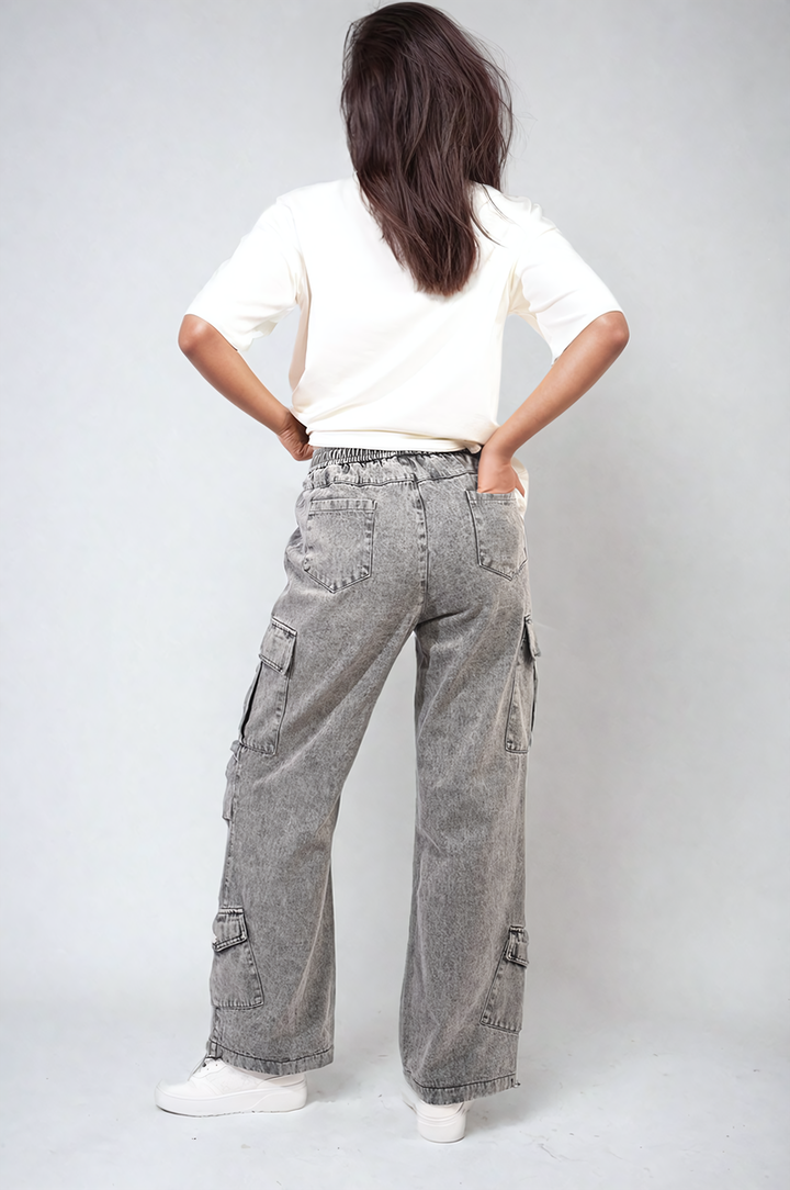 Woman wearing Multi Pockets Drawstring Cargo Jeans with a relaxed fit, showcasing utility pockets. Ideal for casual outings, emphasizing comfort and style from Holiday Clothes UK.