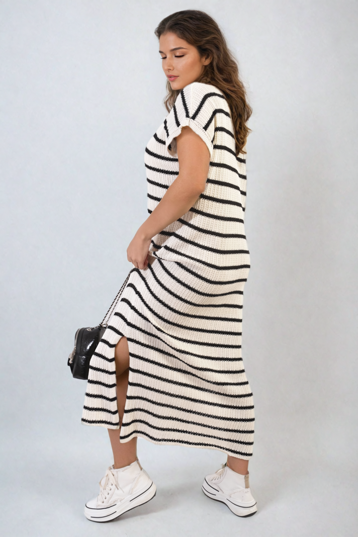 Woman in a Stripe Knitted V Neck Midi Dress, showcasing a modern silhouette with a sophisticated V-neck and flattering striped pattern, ideal for versatile occasions.