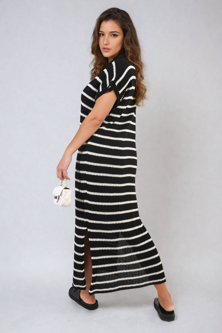 Woman wearing the Stripe Knitted V Neck Midi Dress, showcasing a chic fit with a modern striped design, perfect for versatile holiday or everyday wear.