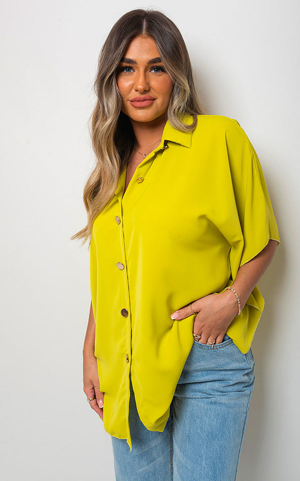 Woman wearing a Button Down V Neck Casual Loose Top, showcasing its classic v-neckline and relaxed fit, ideal for everyday wear.