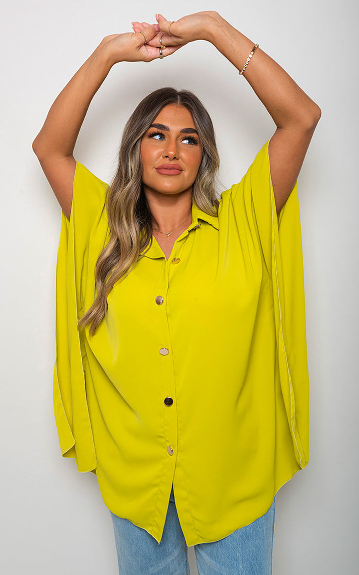 Woman wearing Margaret Button Down V Neck Casual Loose Top, featuring a v-neckline and button closure, showcasing a casual, elegant style.