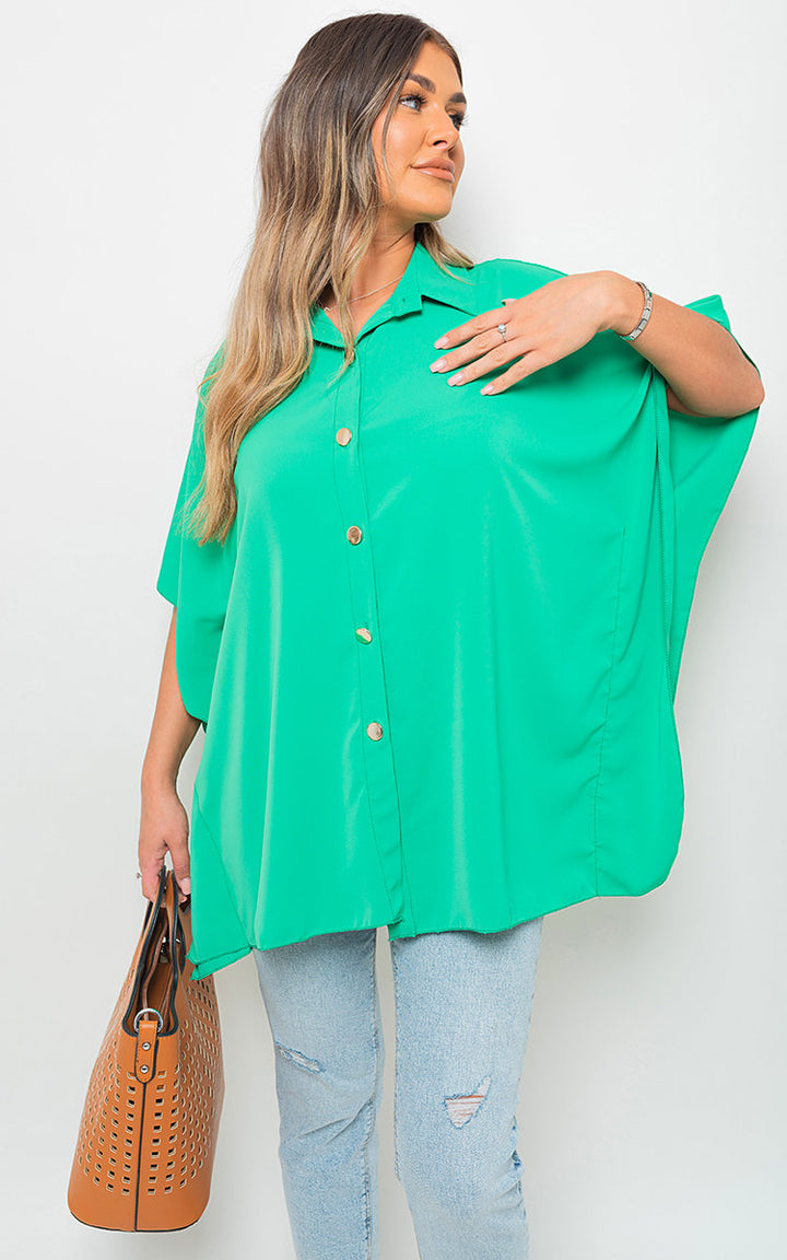 Woman holding the Margaret Button Down V Neck Casual Loose Top, featuring a v-neckline and button-down closure, perfect for everyday style from Holiday Clothes UK.