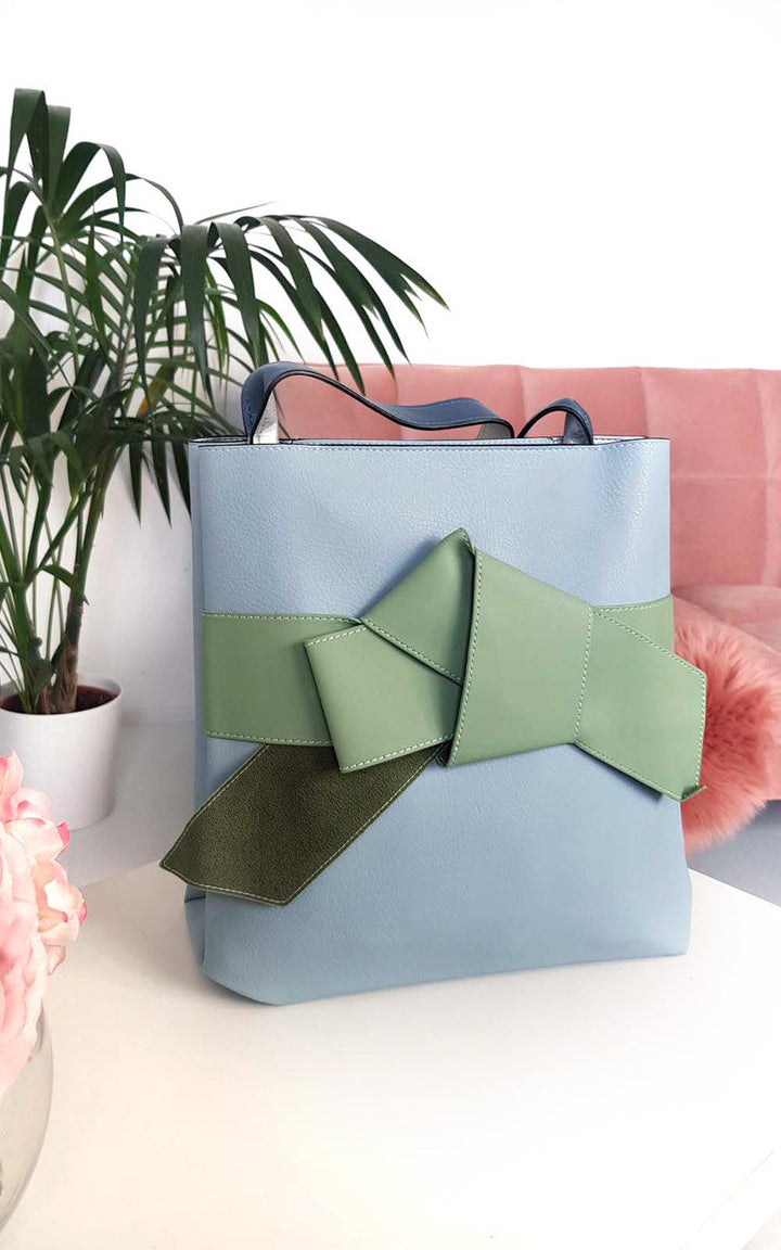 Colour Block Bow Tote Handbag featuring faux leather, handheld strap, and a statement bow on the front, ideal for stylish holiday outfits from Holiday Clothes UK.