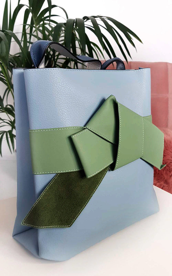 Colour Block Bow Tote Handbag with faux leather, handheld strap, and a striking green bow detail on the front. Perfect for stylish holiday outings.