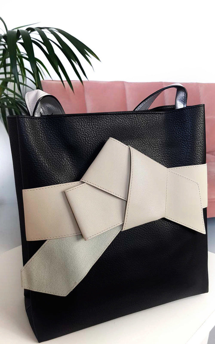 Colour Block Bow Tote Handbag featuring faux leather, handheld strap, and statement bow detail, ideal for stylish holiday and everyday use.