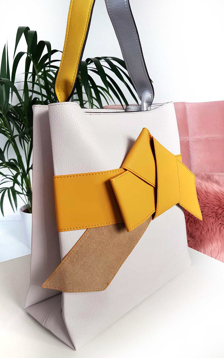 Colour Block Bow Tote Handbag with yellow bow and handheld strap, featuring faux leather and color block design, ideal for stylish holiday outings.